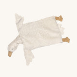 Senger Stone Pine Pillow - Goose with a white square body, white face, wings and tail, and light brown feet and beak on a cream background