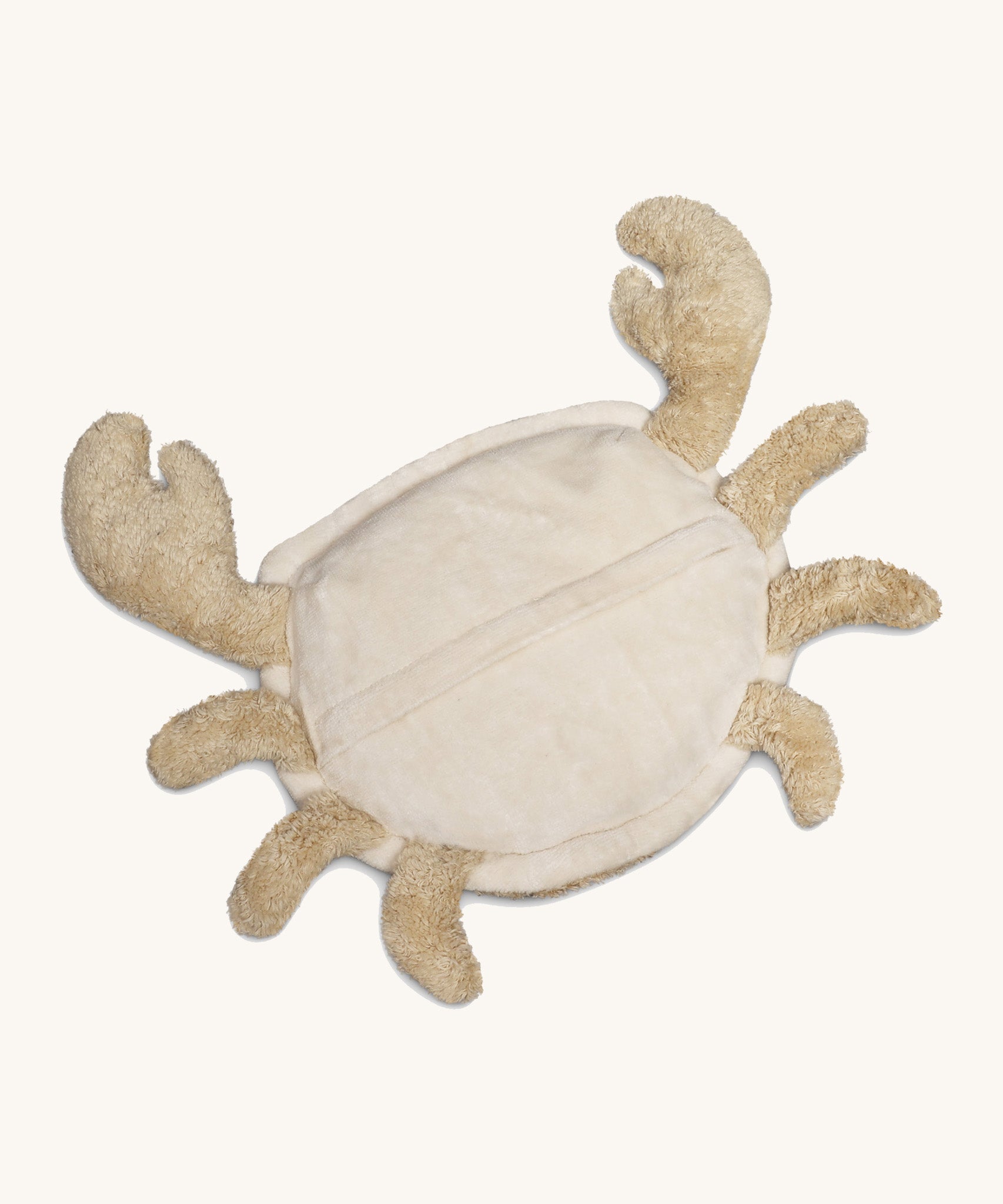 Underside of the Senger Naturwelt small cuddly crab in a light beige colour showing the zip opening for the heat cushion. Organic GOTS cotton plush soft toy with natural wool filling and spelt husk heat cushion.