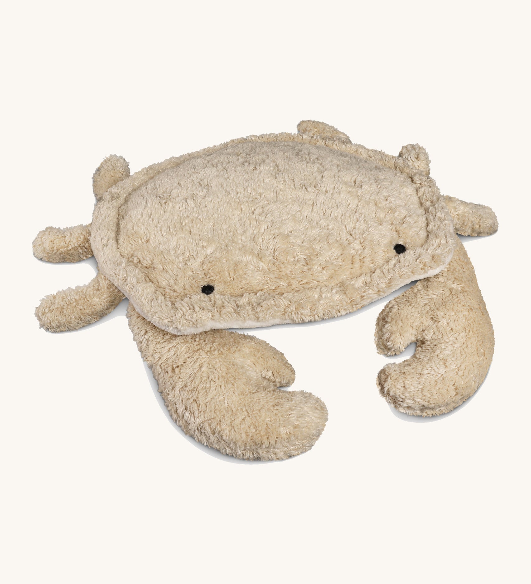 Senger Naturwelt small cuddly crab in a light beige colour with little black eyes, organic GOTS cotton plush soft toy with natural wool filling and spelt husk heat cushion.