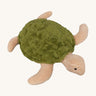 Senger Small Cuddly Turtle - Green is a soft and squishy turtle teddy with a light tan/beige body and a mossy green shell. The image is on a cream background