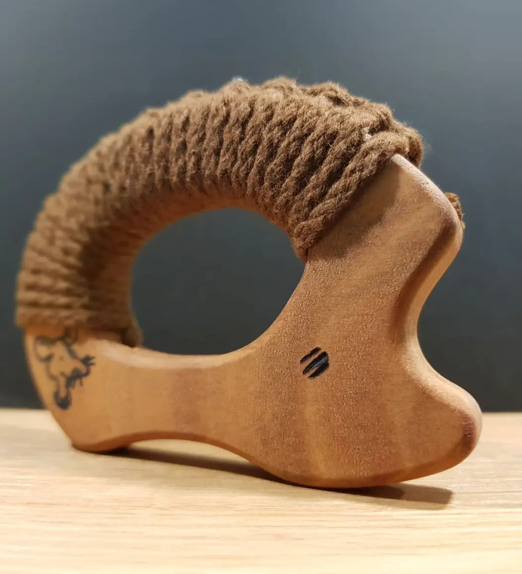 A standing Senger wooden grasping and teething hedgehog showing painted    eyes 