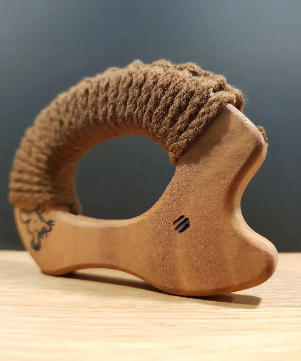 A standing Senger wooden grasping and teething hedgehog showing painted    eyes 