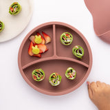 Eco Rascals Silicone Baby Plate in rose pink with removable divider, fresh fruit and green wraps.  