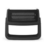 The SnuzPod5 bedside baby crib with a graphite black wooden frame, black mesh sides, and a white mattress. 