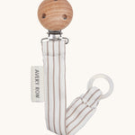 Avery Row Pacifier Holder - Stripe, showing the silicone ring and wooden clip