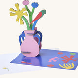 Studio roof  Matisse Paper Bloom inspired bouquet 3D pop out card standing next to a matching greetings card