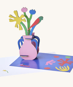 Studio roof  Matisse Paper Bloom inspired bouquet 3D pop out card standing next to a matching greetings card