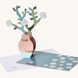 Studio Roof Van Gough inspired bouquet with almond blossoms standing next to a matching greetings card