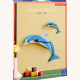 The cardboard packaging for the dolphin couple family wall decoration available at Babipur.