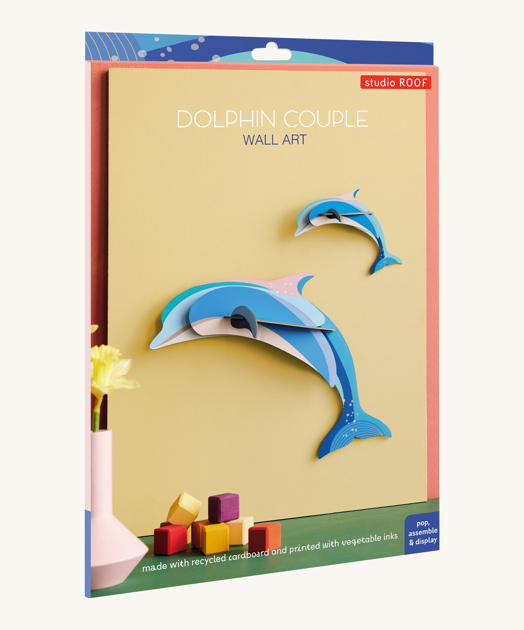 The cardboard packaging for the dolphin couple family wall decoration available at Babipur.