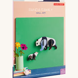 The cardboard packaging for the panda family wall decoration available at Babipur.