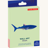 The cardboard packaging for the shark wall decoration available at Babipur.