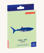 The cardboard packaging for the shark wall decoration available at Babipur.