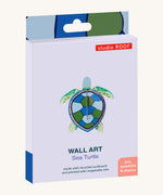 The cardboard packaging for the small turtle wall decoration available at Babipur.