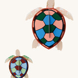 Studio Roof sea turtles wall decoration available at Babipur. Features a thick cardboard DIY kit of an adult and baby sea turtle to hang on a wall