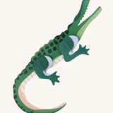 Studio Roof tall crcocdile wall decoration available at Babipur. A thick green cardboard shark DIY kit to hang on a wall