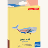 The cardboard packaging for the whale wall decoration available at Babipur.