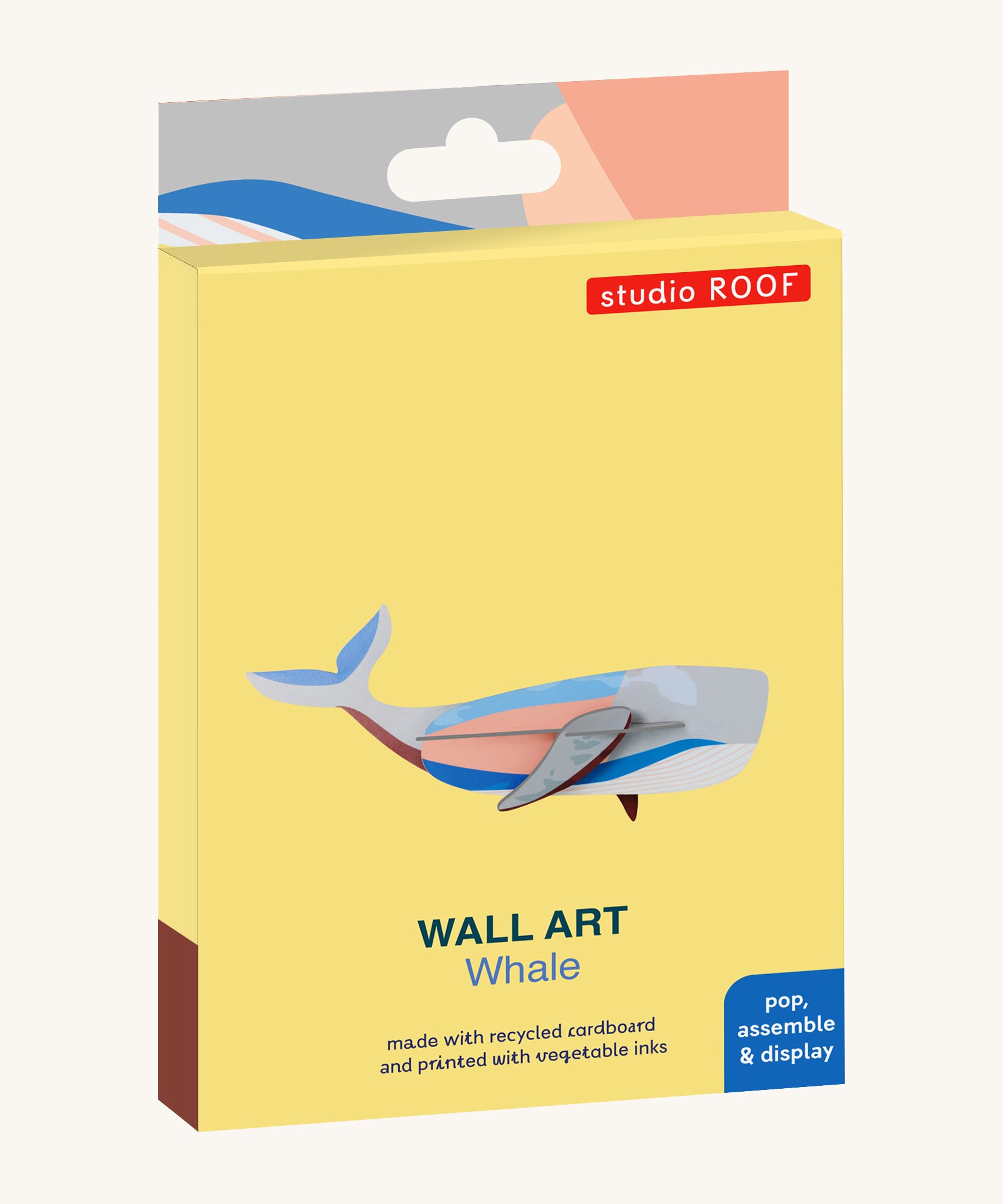 The cardboard packaging for the whale wall decoration available at Babipur.