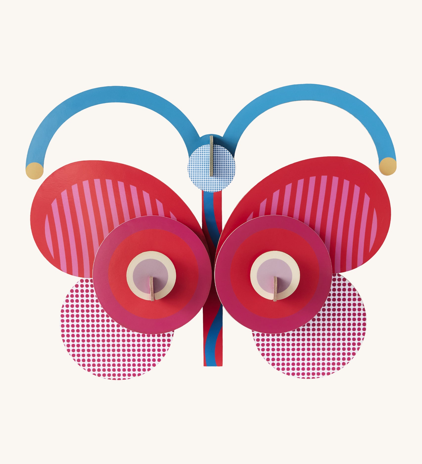 A bright and retro style stripy butterfly wall decoration available at Babipur. A Studio roof collaboration with artist Zoe Miller. 
