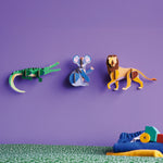 3 Studio Roof 3D Cardboard Models of Wildlife Animals on a purple wall - the Crocodile, Koala and the Lion. They are pictured with decorative objects.