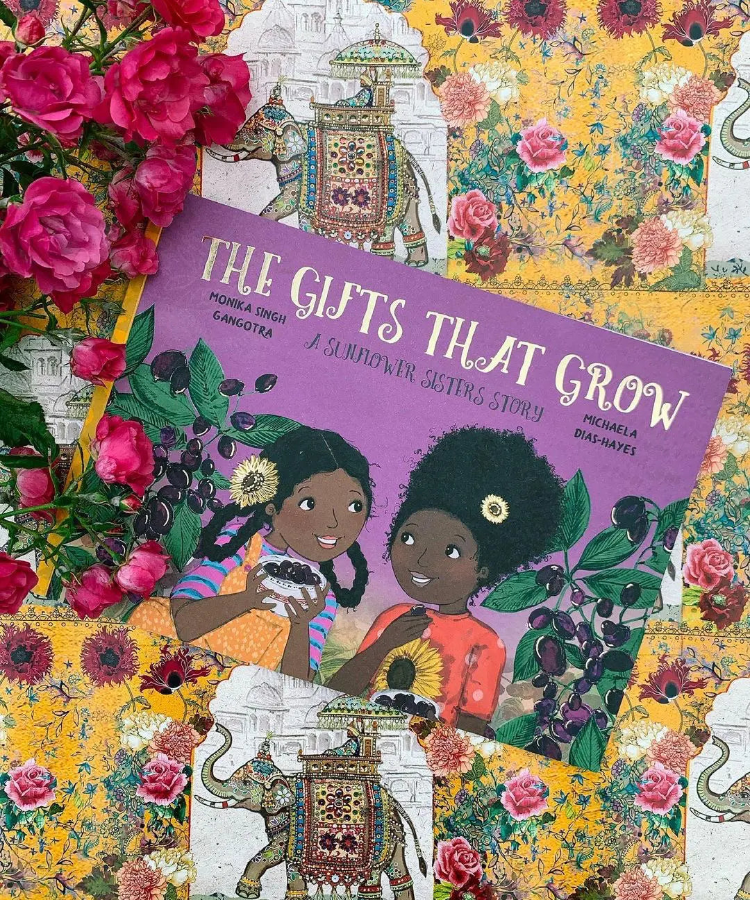 The Gifts That Grow children's book written by Monika Singh Gangotra and illustrated by Michaela Dias-Hayes, cover shows two girls next to Jamun plant trees.