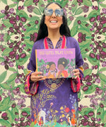 The Gifts That Grow children's book held by author Monika Singh Gangotra.