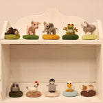 The Makerss - Amiguwoolli collection stood on white wooden shelves