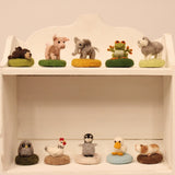 The Makerss - Amiguwoolli collection stood on white wooden shelves