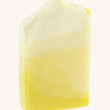 The Soapmine bucks fizz bar. A Christmas inspired Handmade soap available at Babipur with champagne and citrus orange notes. Soap bar has a yellow/orange gradient look