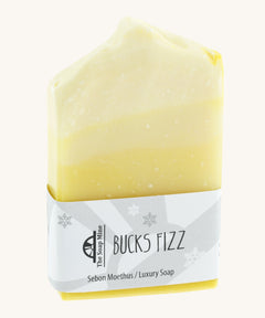 The Soapmine bucks fizz bar. A Christmas inspired Handmade soap available at Babipur notes of champagne and citrus orange. Comes with branding paper strip. 
