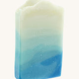 The Soapmine snow fairy bar. A Christmas inspired Handmade soap available at Babipur with rose, raspberry and musky notes. Soap bar has a blue wavy gradient look
