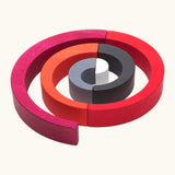 A swirl structure made from Tobe wooden asymmetrical arches could be used as a ball run