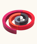 A swirl structure made from Tobe wooden asymmetrical arches could be used as a ball run