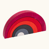 Tobe asymmetrical arches building set showing red, black grey and white wooden arch building blocks