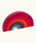 Tobe asymmetrical arches building set showing red, black grey and white wooden arch building blocks