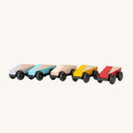 The Bajo Tobe Poly cars, in a row on a cream background