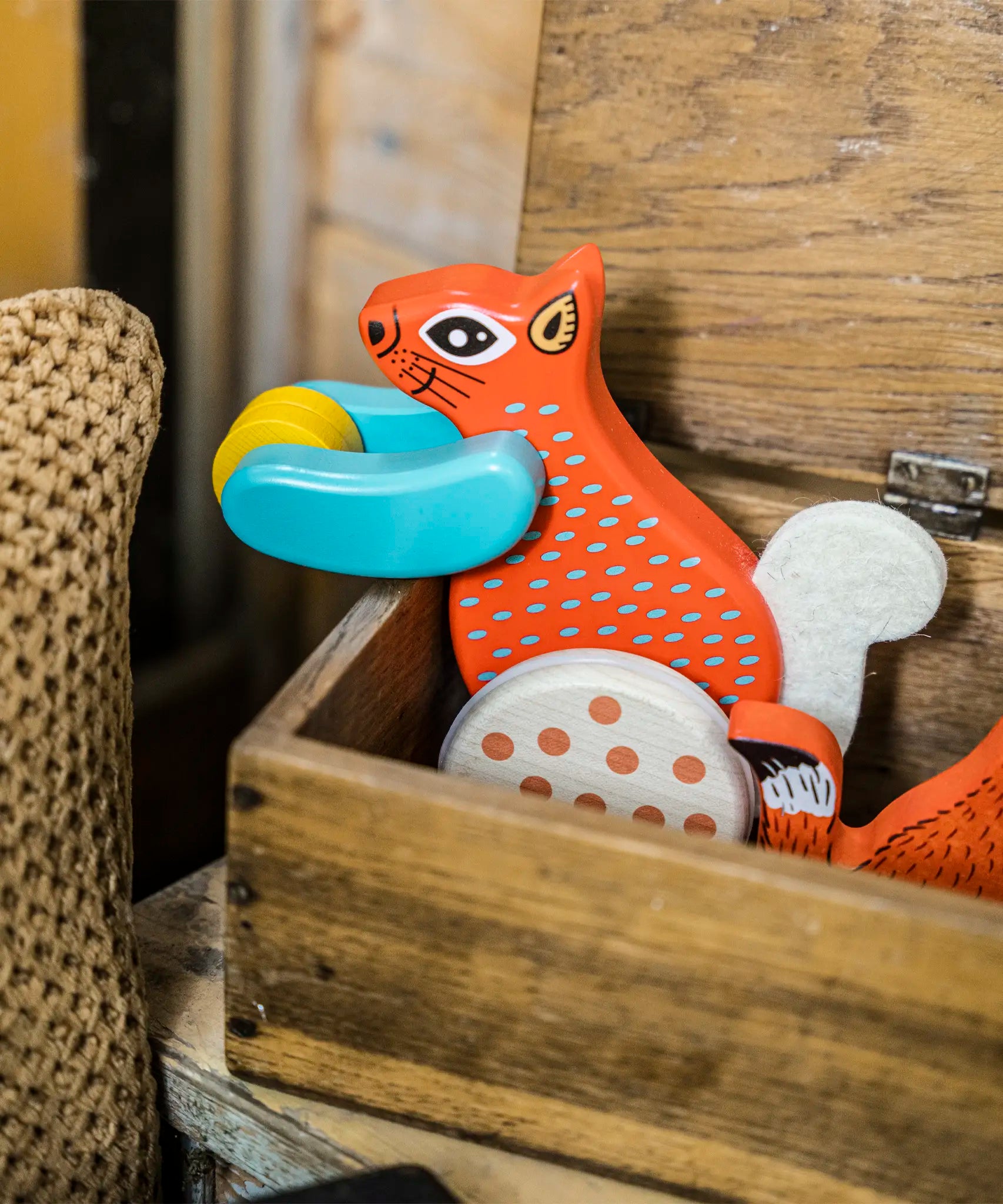 Bajo x Tobe red wooden jumping squirrel toy inside a wooden box 