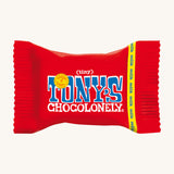 The Tony's Chocolonely Tiny Chocolate in its red wrapper, on a cream background