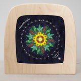 Toverlux advent calender sonne mond und erde silhouette available at Babipur.  Displayed in a wooden Toverlux lantern  showing a starry night and festive inspired with each date window in a circle