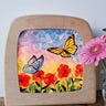 Toverlux DIY Transparencies with red poppies and butterflies artwork shown in a wooden magic window frame.