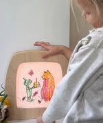 Toverlux colouring silhouette book by Daniela Dreschers available at Babipur and showing a silhouette of a cat and goblin   