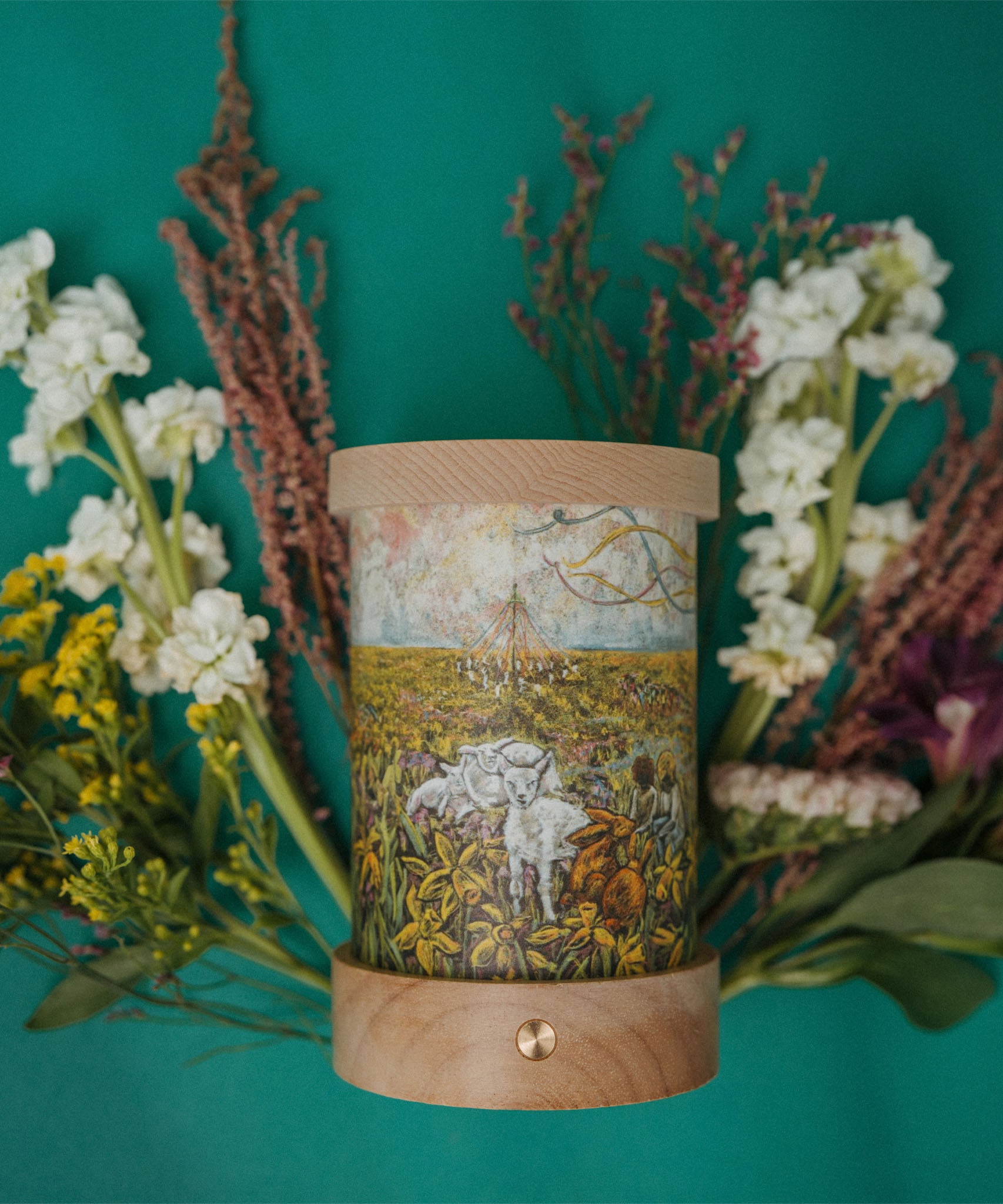 A cosy spring floral inspired flatlay with the Toverlux rechargeable lantern with a silhouette inserted. Both the illustration and lantern are both available at Babipur.