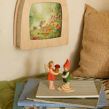 Toverlux Magic lamp on wall with Anne Illustrates toadstool artwork next to Ostheimer Pepe, Sumselinchen and snail.