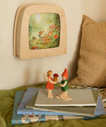 Toverlux Magic lamp on wall with Anne Illustrates toadstool artwork next to Ostheimer Pepe, Sumselinchen and snail.
