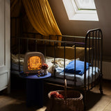 Toverlux Magic Lamp with library artwork by Mhairi Hellbrandt in child's bedroom.