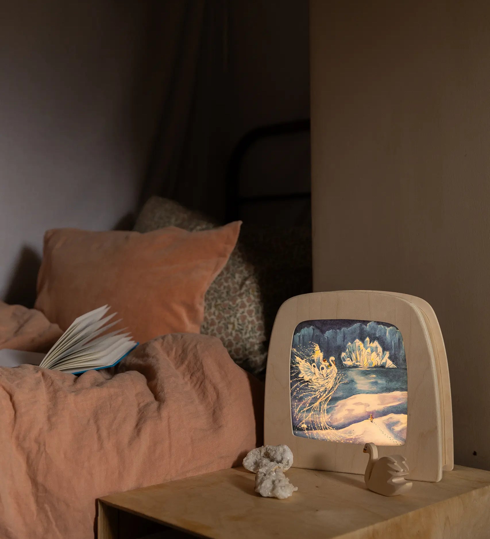 Toverlux Magic Lamp with ice queen swan artwork by Mhairi Hellbrandt in bedroom setting with Ostheimer swan.