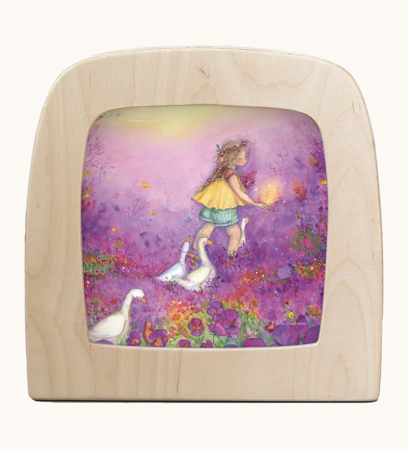Toverlux little goose girl silhouette by Anne illustrates that fit in a wooden magic lamp. Shows a water colour style of a girl in a purple floral field with geese