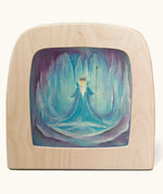 A Toverlux silhouette in the magic lamp withWinter ice king artwork by Baukje Exler. A pastel illustration of a ice king surrounded by icicles.
