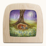 Toverlux little fox family silhouette by Baukje Exler. A pastel illustration of a fox family under a tree. Silhouette in wooden magic lamp