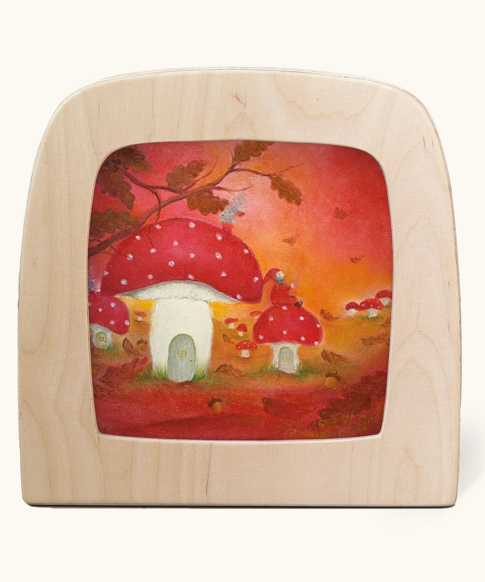 A Toverlux silhouette in the magic lamp with red autumn  artwork by Baukje Exler. An illustration of little toadstool houses.